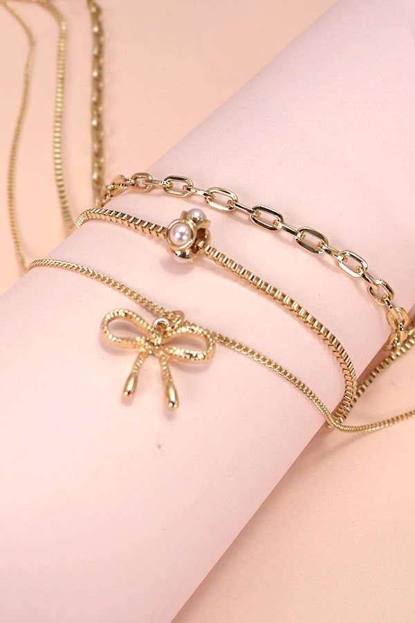 MULTI LAYER PEARL BOW CHARM NECKLACE