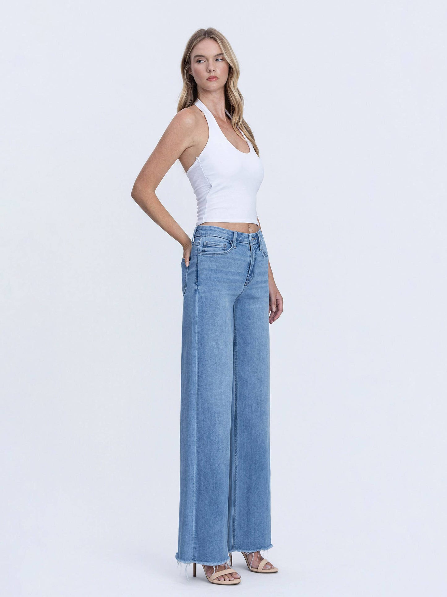 VERVET HIGH RISE MEDIUM WASH FRAYED HEM WIDE LEG JEANS