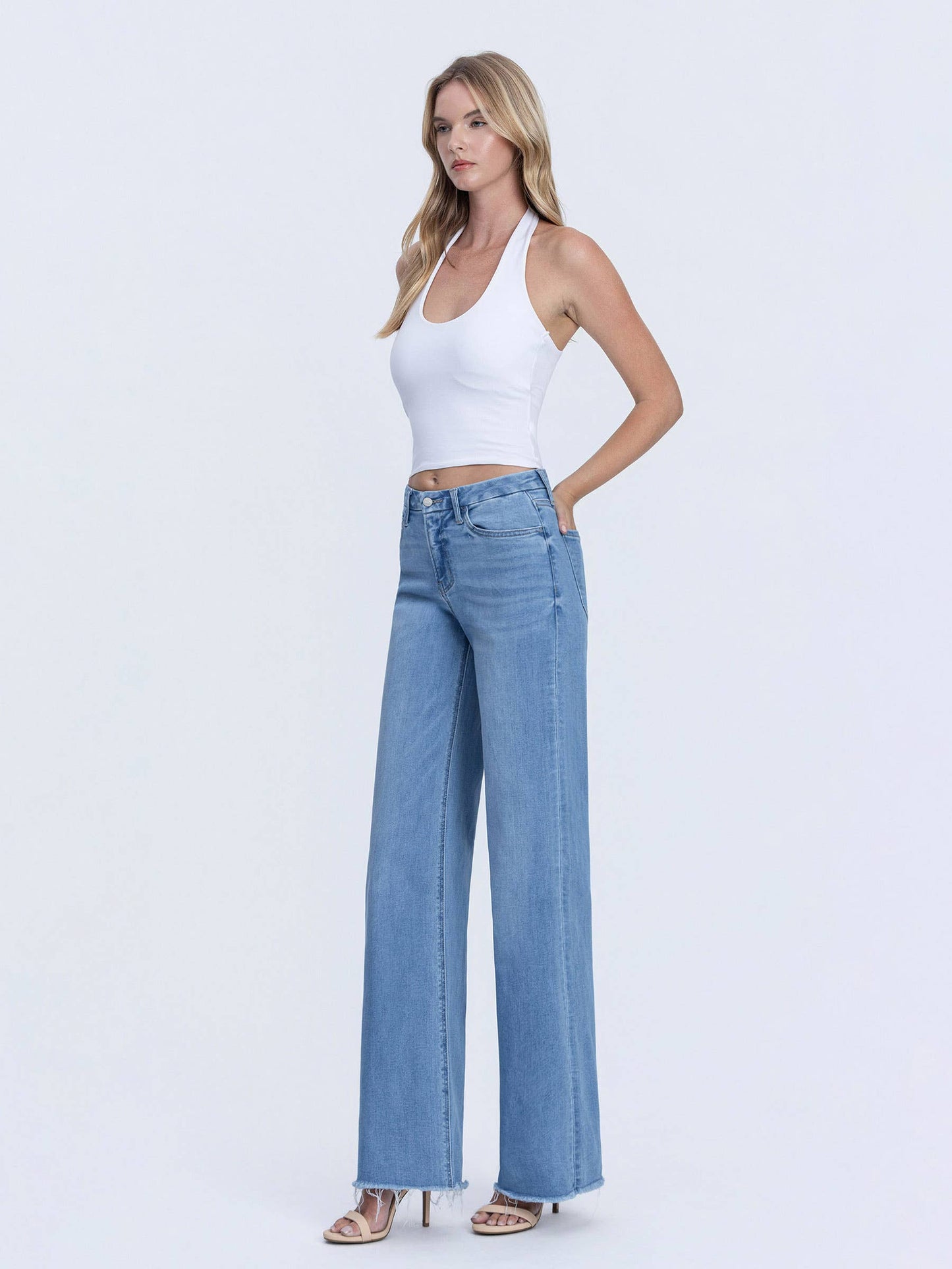VERVET HIGH RISE MEDIUM WASH FRAYED HEM WIDE LEG JEANS
